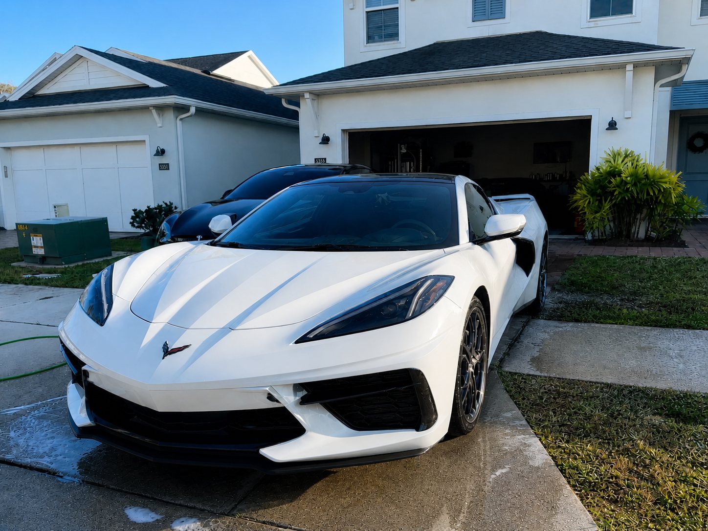 Mobile auto detailing in Orlando, FL · Chevrolet Corvette after at customer driveway with polished paint